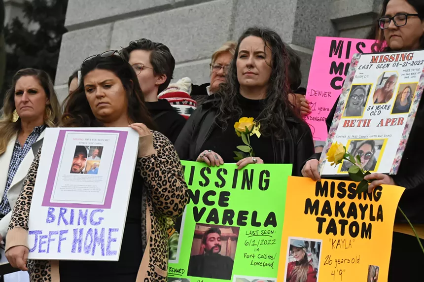 Lindsey Paison stands with others to honor missing persons.