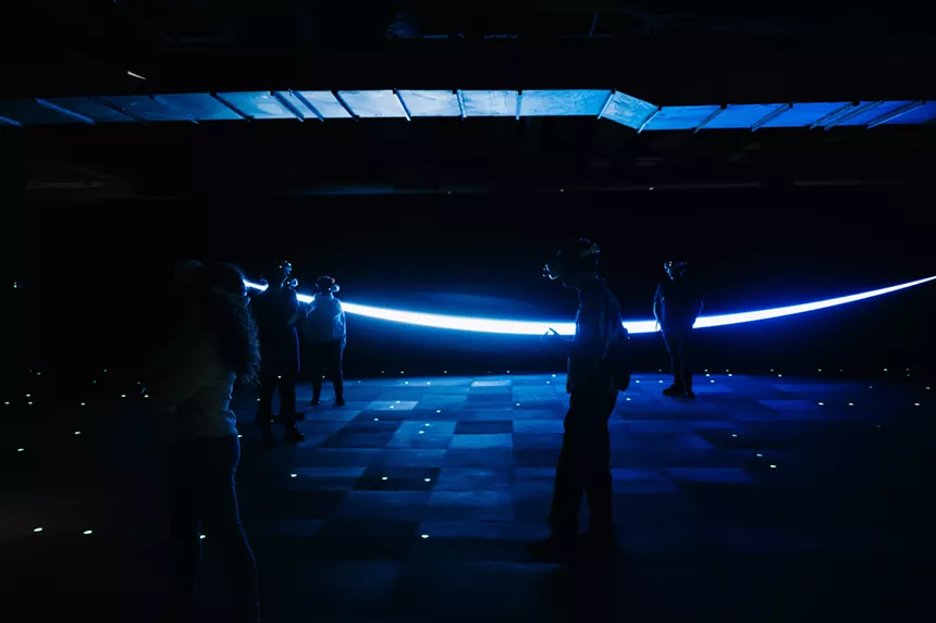 people in a room wearing VR headsets