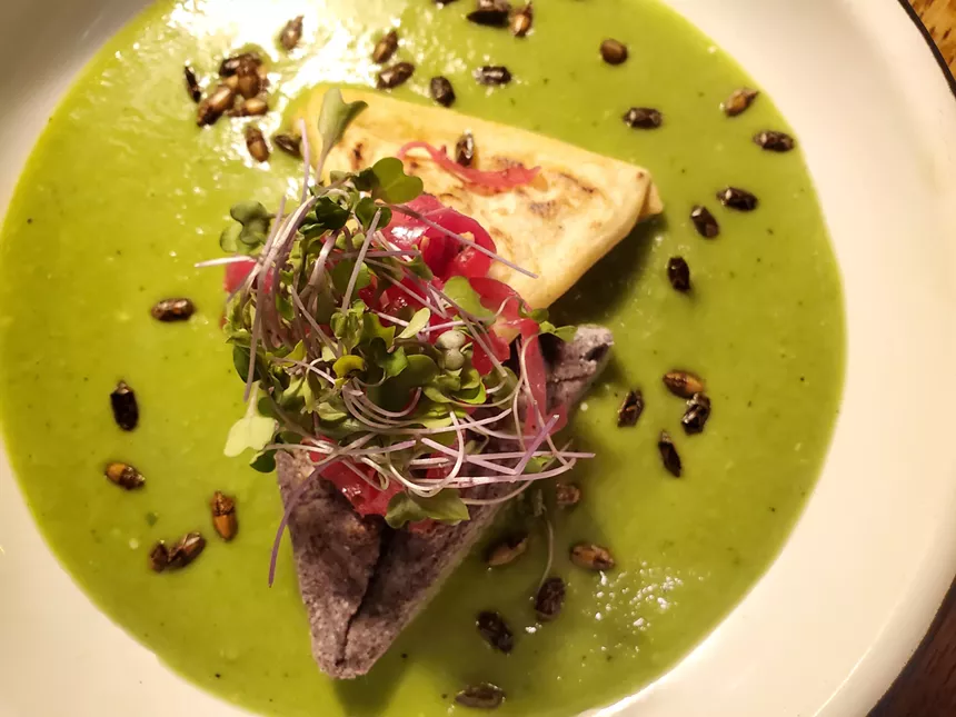 a dish with green sauce