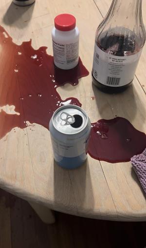 spilled tart cherry juice on a kitchen table