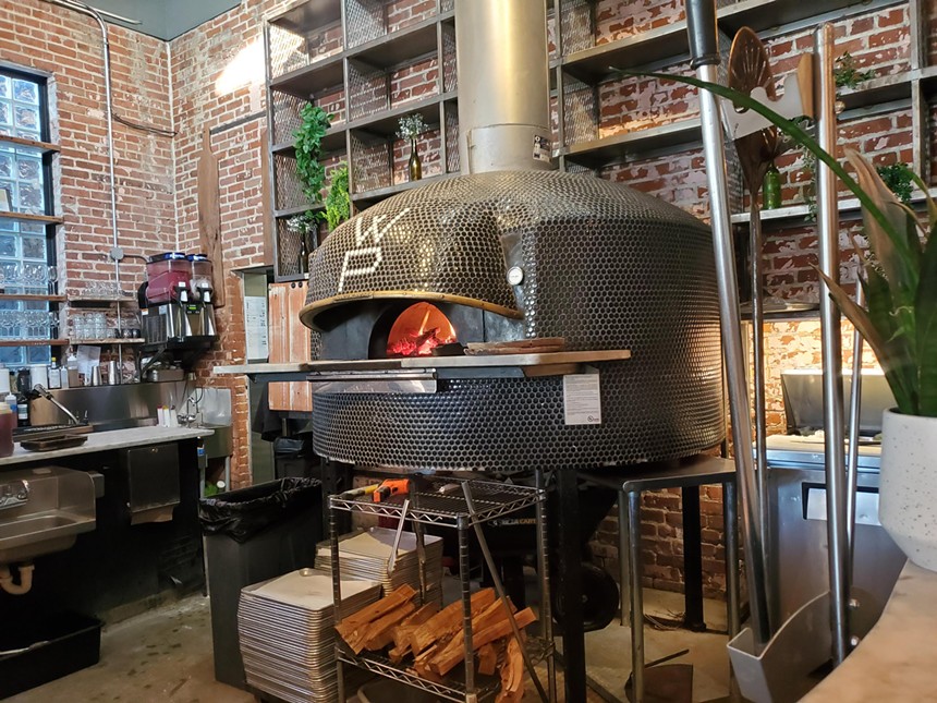 a wood-burning oven inside a restaurant