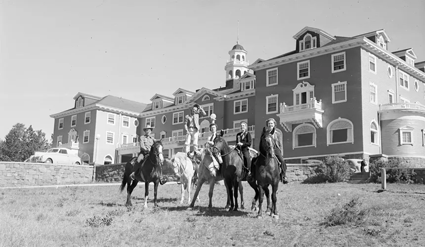 people on horseback in front of Stanley