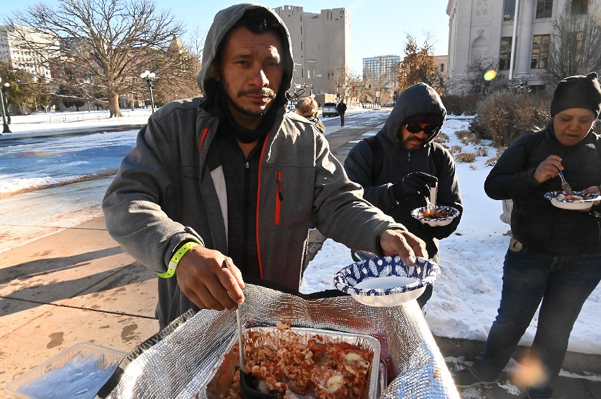 A migrant gets a warm meal.