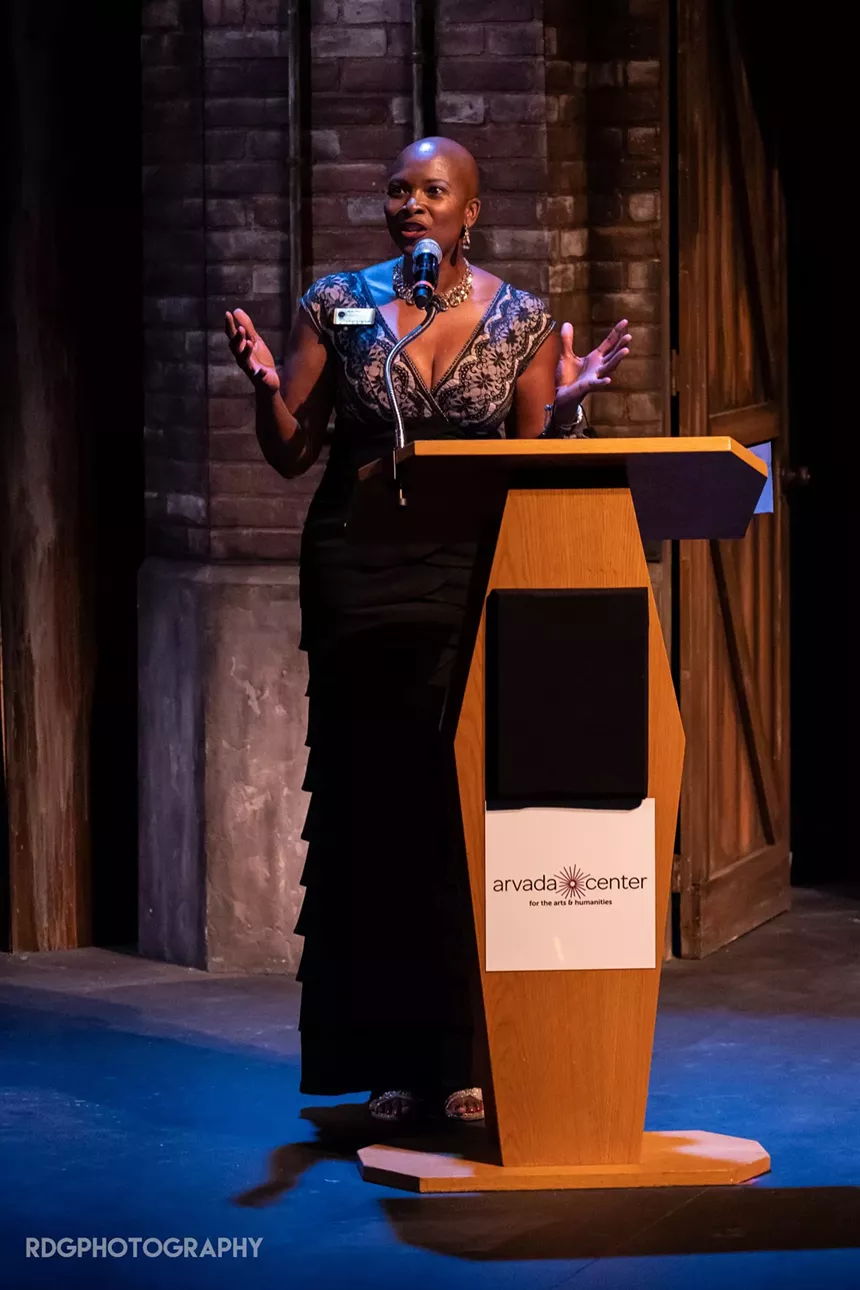 woman speaking at a podium