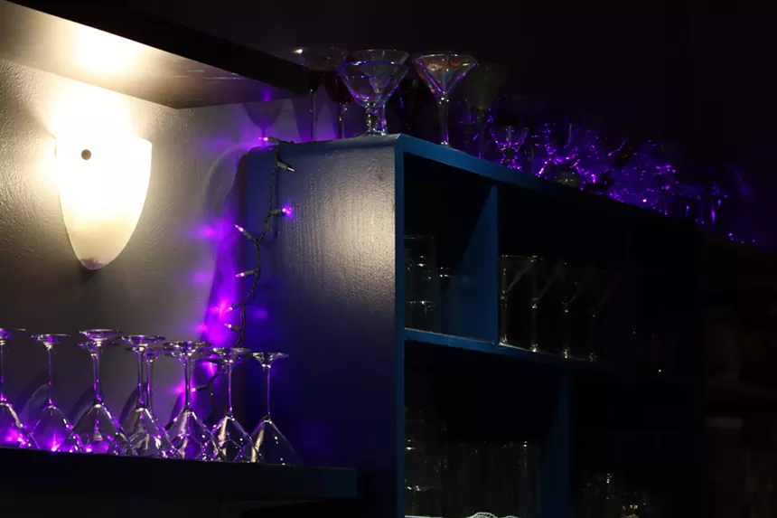 martini glasses stacked on shelves