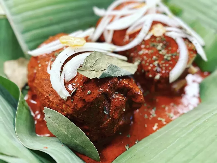 Pork shank pibil in banana leaves