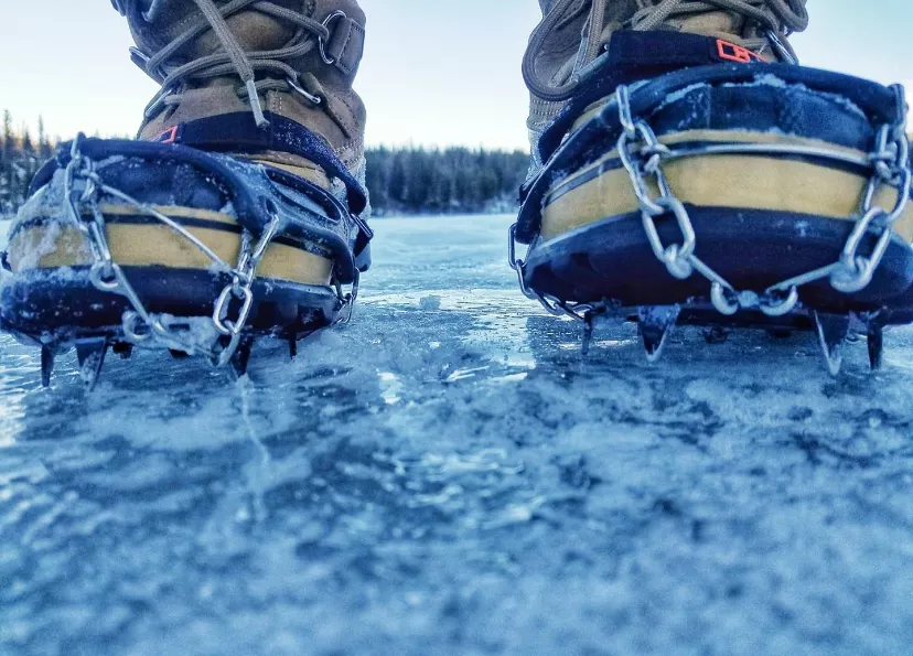 hiking boots with microspikes on them