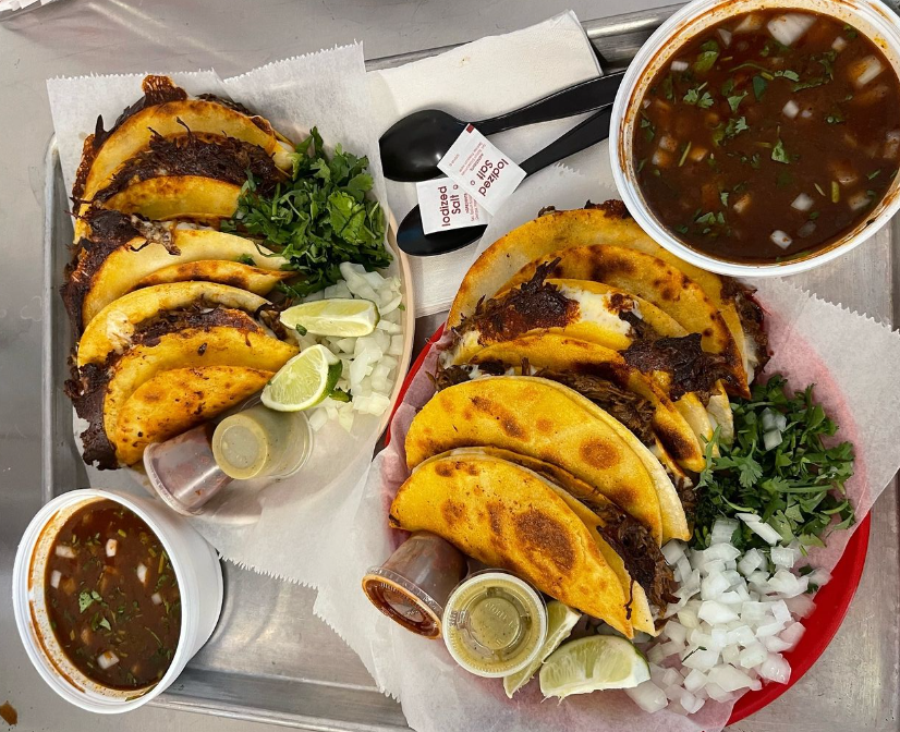 a tray with tacos and consomé.