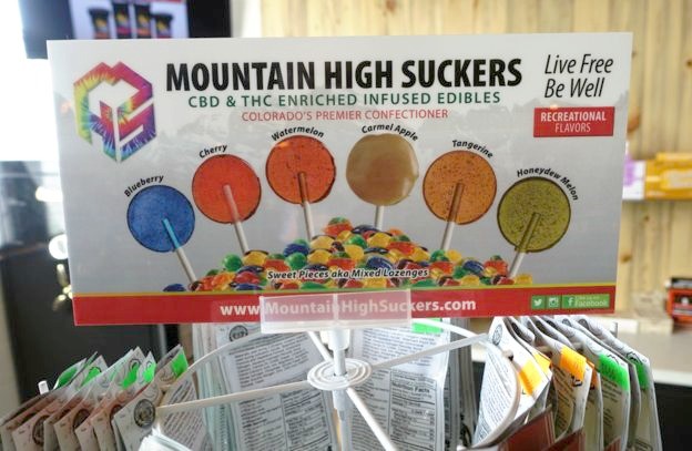 A display of colored thc-infused lollipops