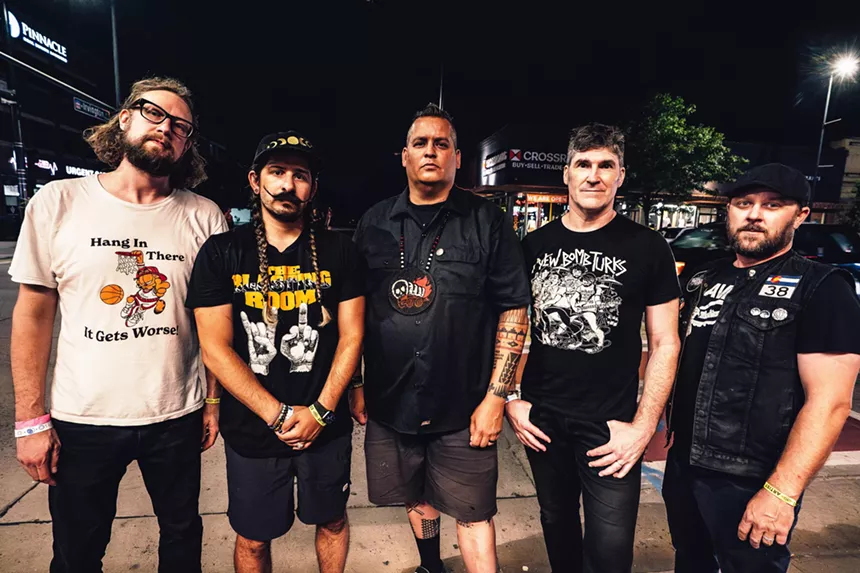 five bandmates pose for a picture