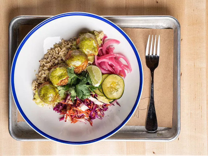 a grain bowl on a white plate