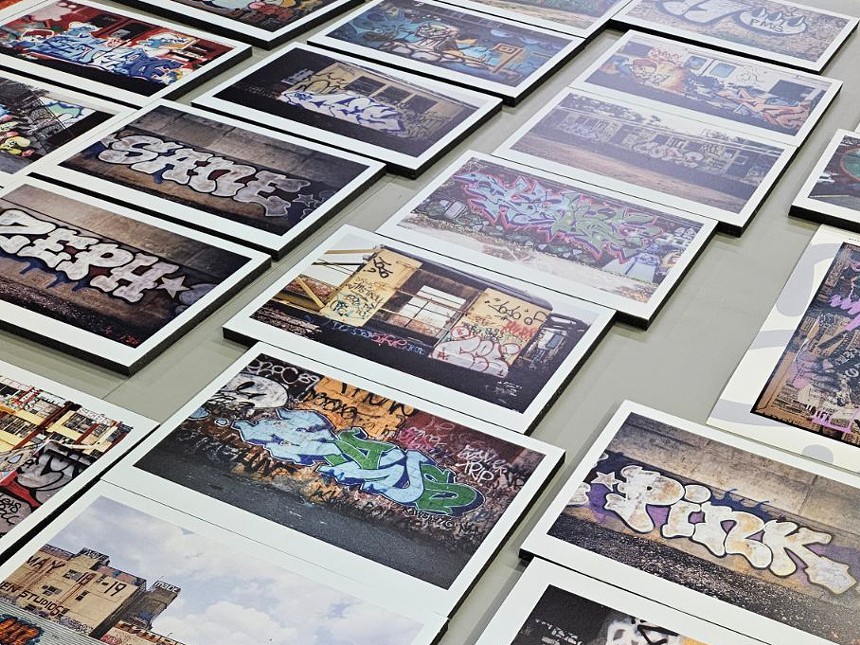 photos of graffiti laid out on a table