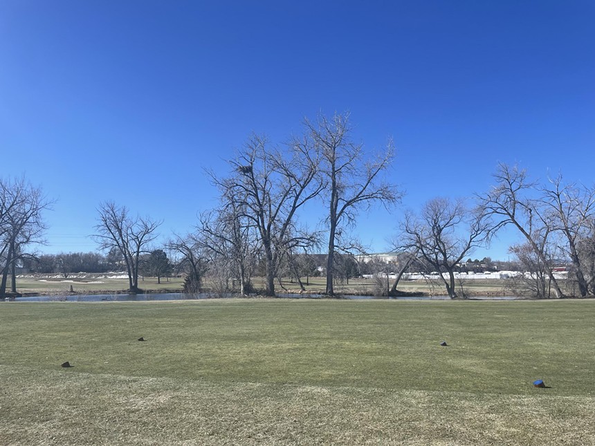 Blue tee box on a Colorado golf course in the winter
