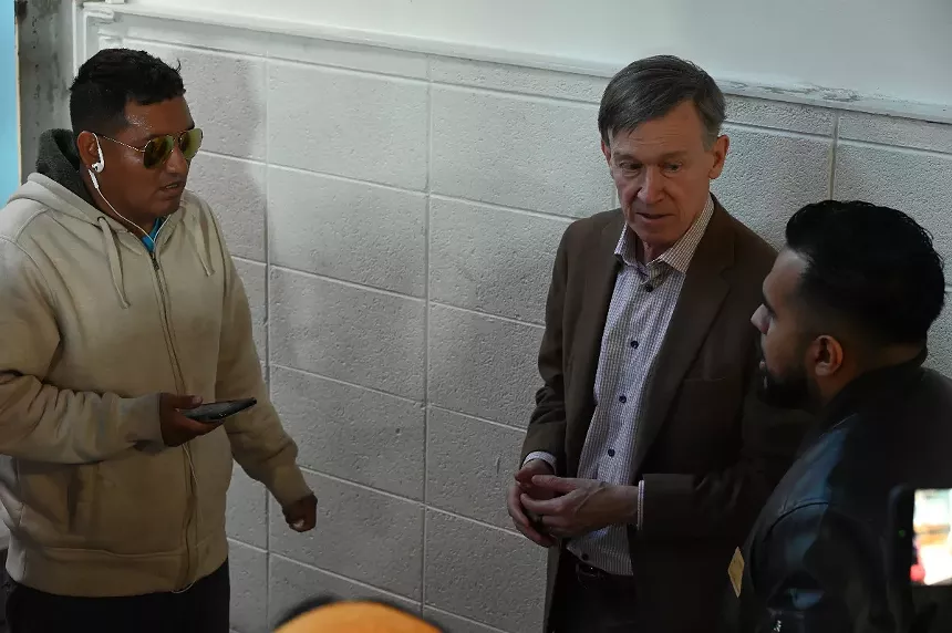 Hickenlooper uses his translator.