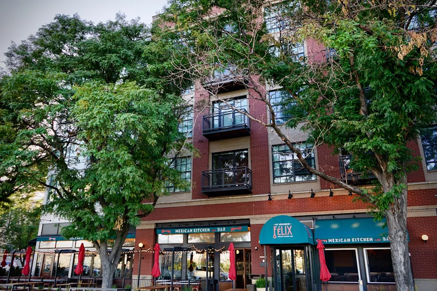 awning over an entrance on a brick building