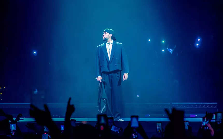 man in suit on stage