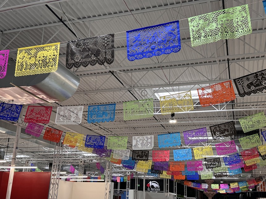 colorful flags hanging from a ceiling