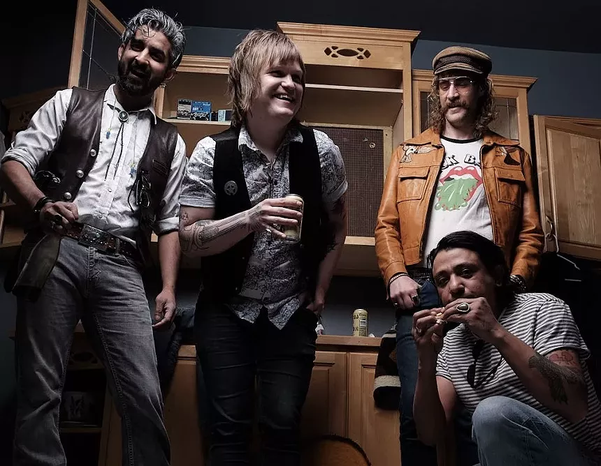 bandmates pose for a picture