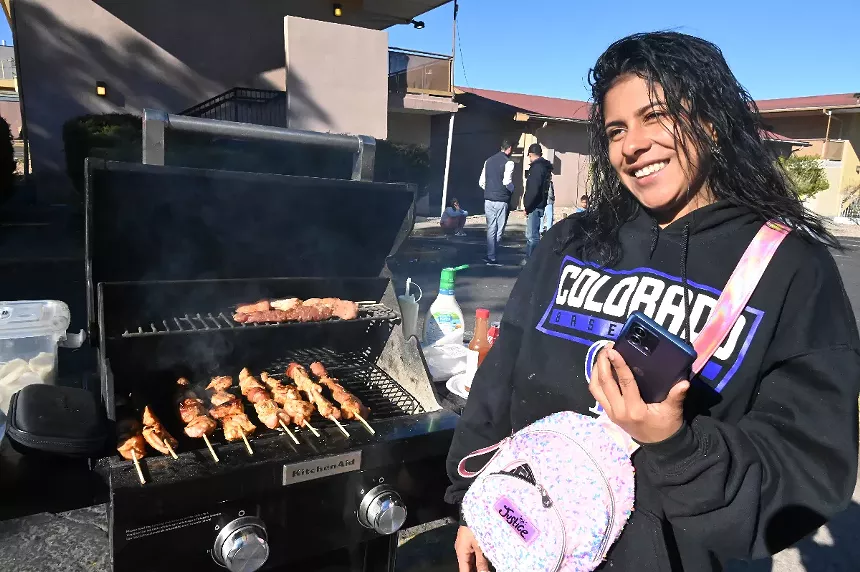 A migrant grilling.
