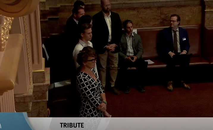 Family stands during senate session in Colorado