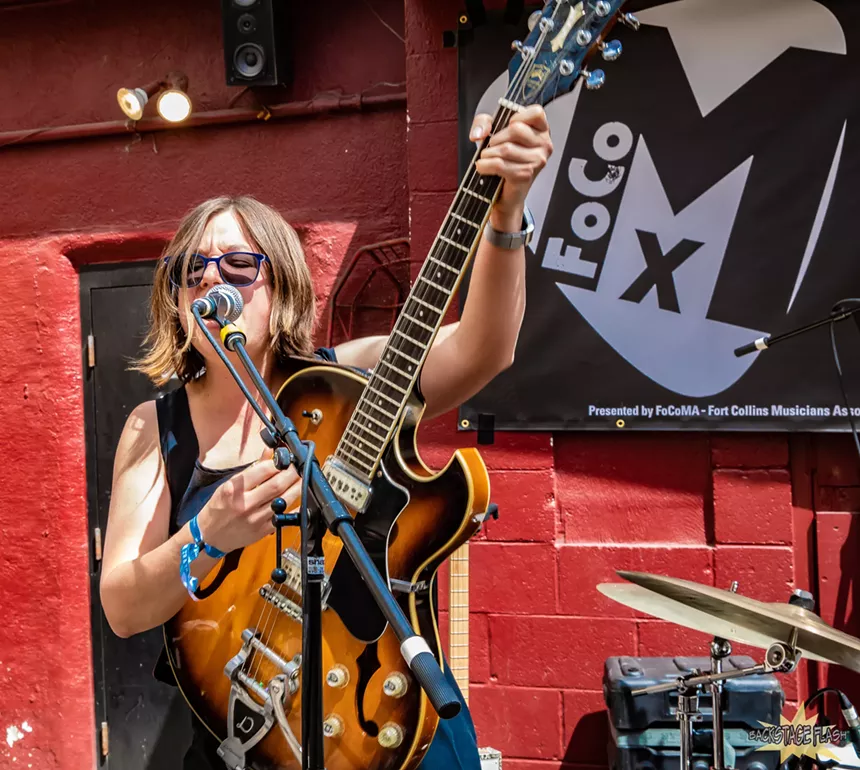 woman playing guitar