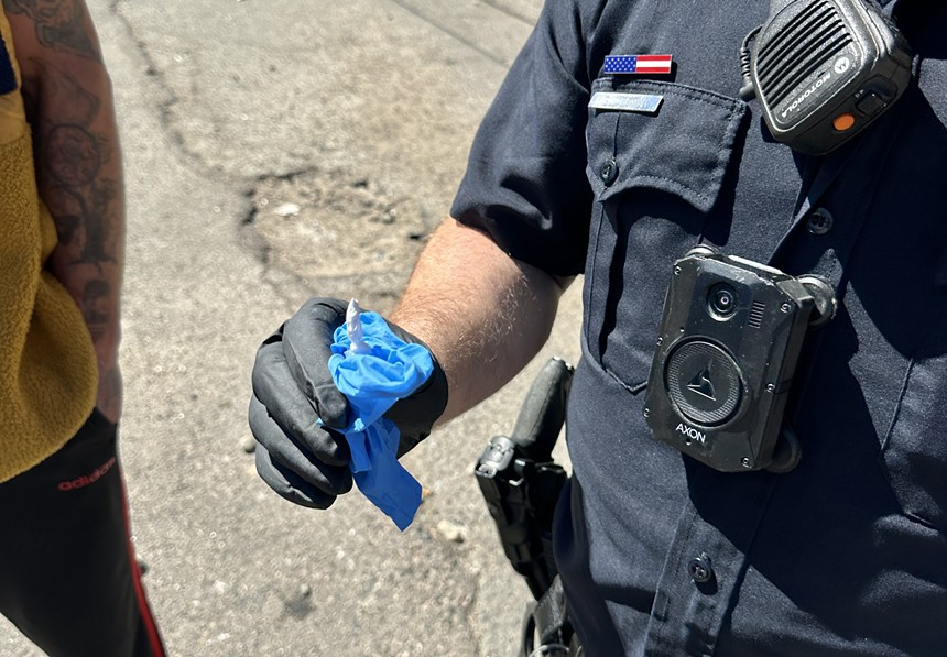 A small bag of drugs being held by a Denver police oficder.