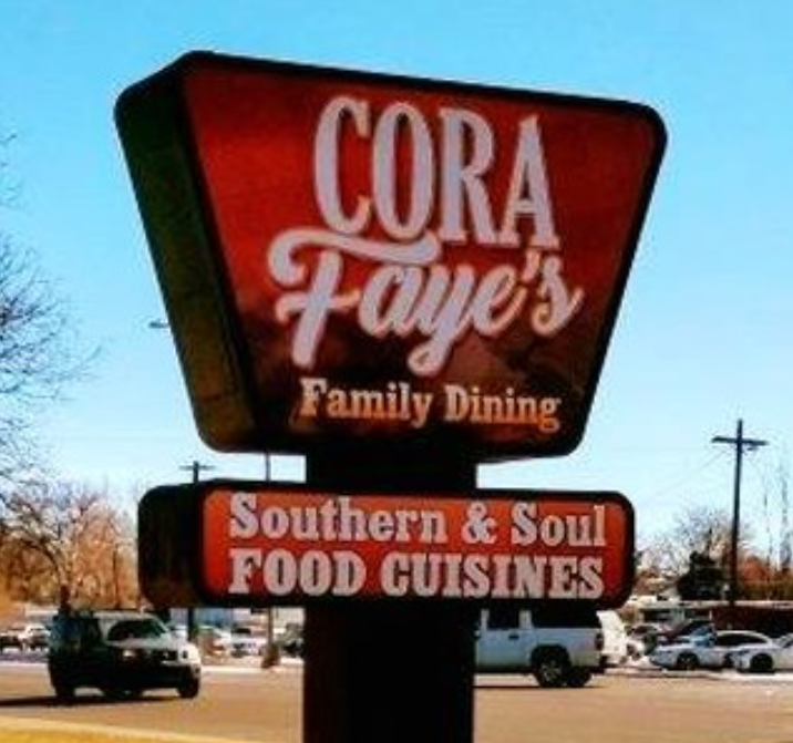 a red sign that says "CoraFaye's"
