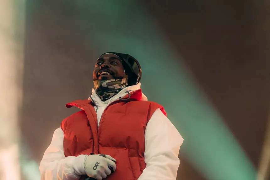 man in red puffer vest