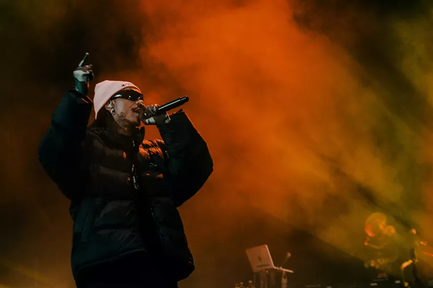 man rapping into a microphone