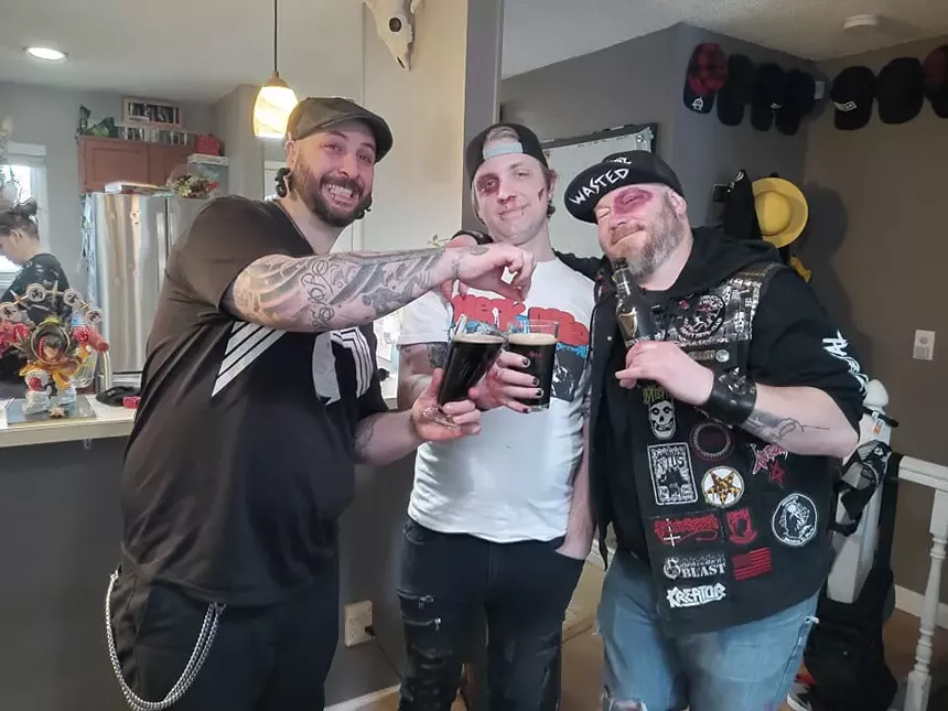 punk bandmates holding beer