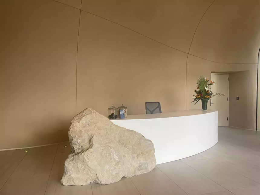 One River north lobby with rock reception desk