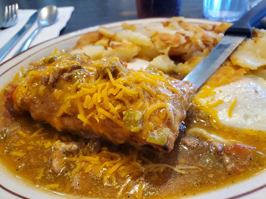 Chile relleno smothered in green chile and eggs