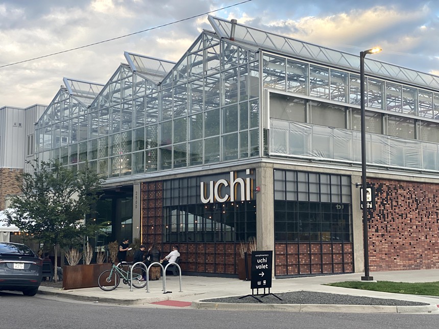 exterior of a building with a sign that says "uchi"
