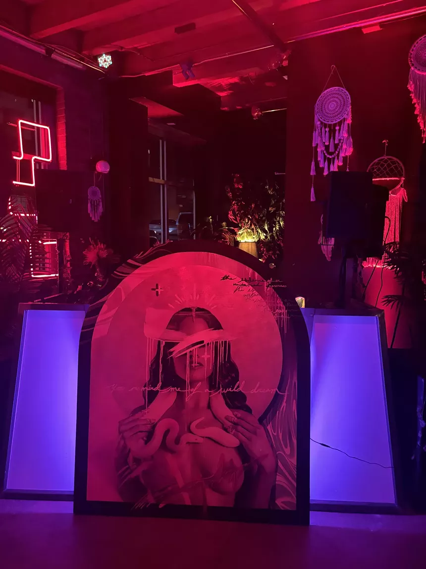 painting of a naked woman in red lighting