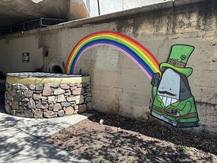 An art mural of a leprechaun and a rainbow.