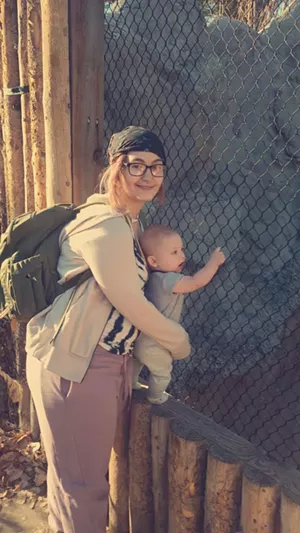 A woman holding a baby.