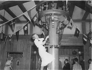 woman climbing crow's nest
