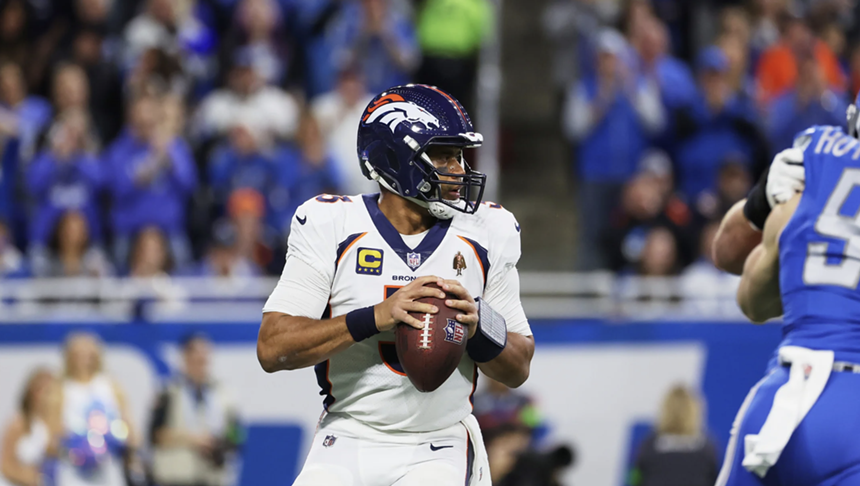 Denver Broncos quarterback Russell Wilson dropping back for a pass against the Detroit Lions.