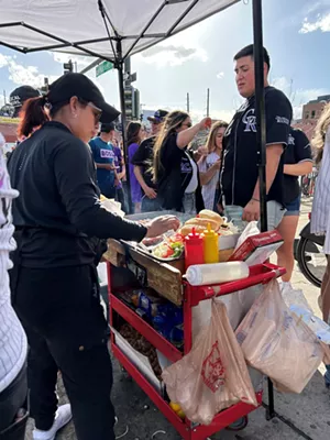 Hot dog cart at baseball game