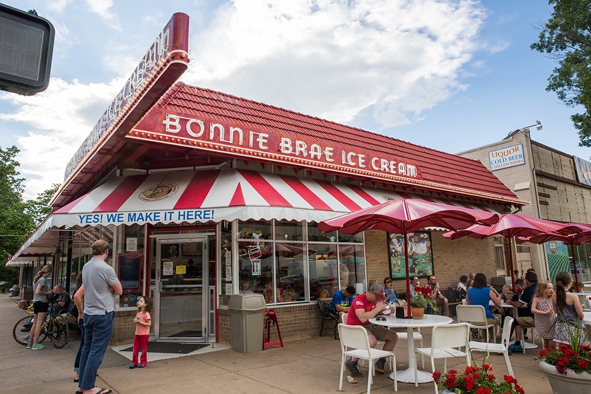 exterior of an ice cream shop with a red and white striped awning