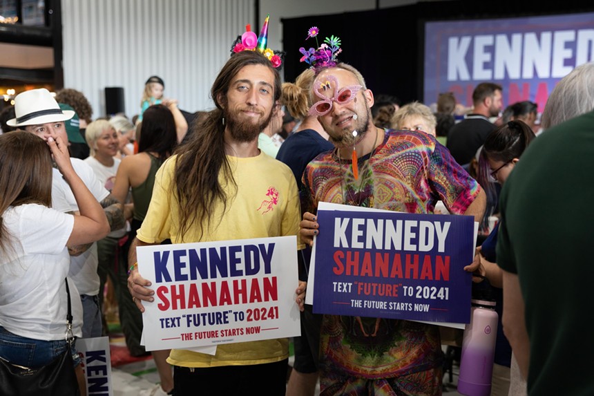 two men with campaign signs