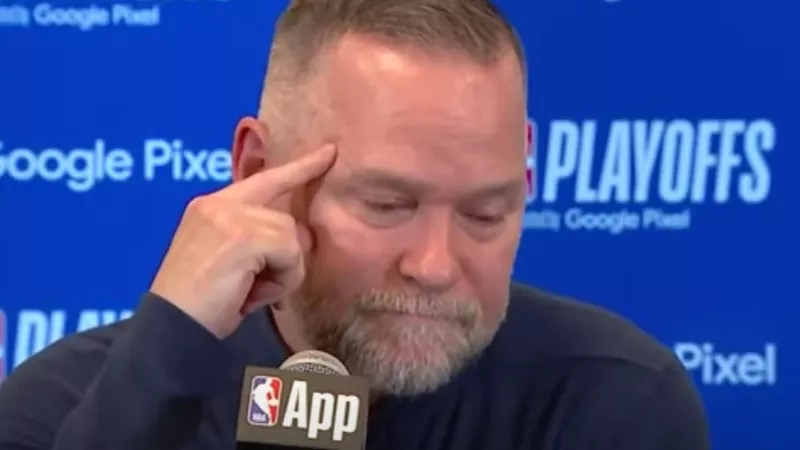 Nuggets coach Michael Malone speaking to media.