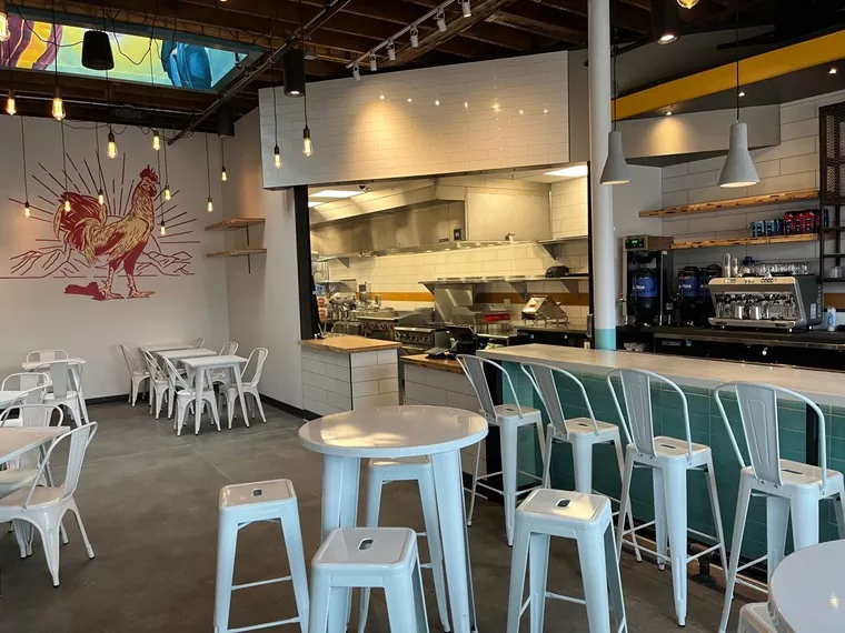 tables and stools inside a restaurant