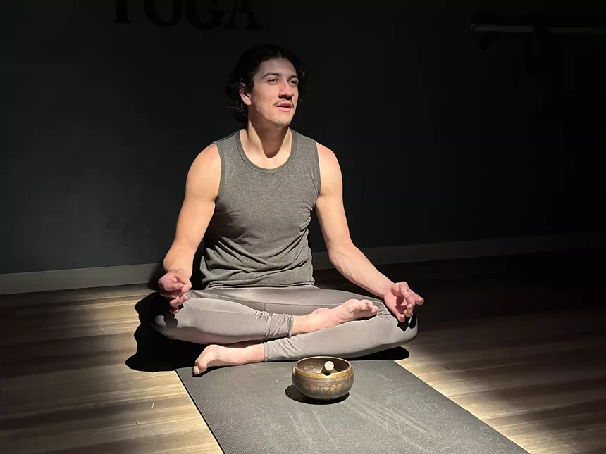 man practicing yoga