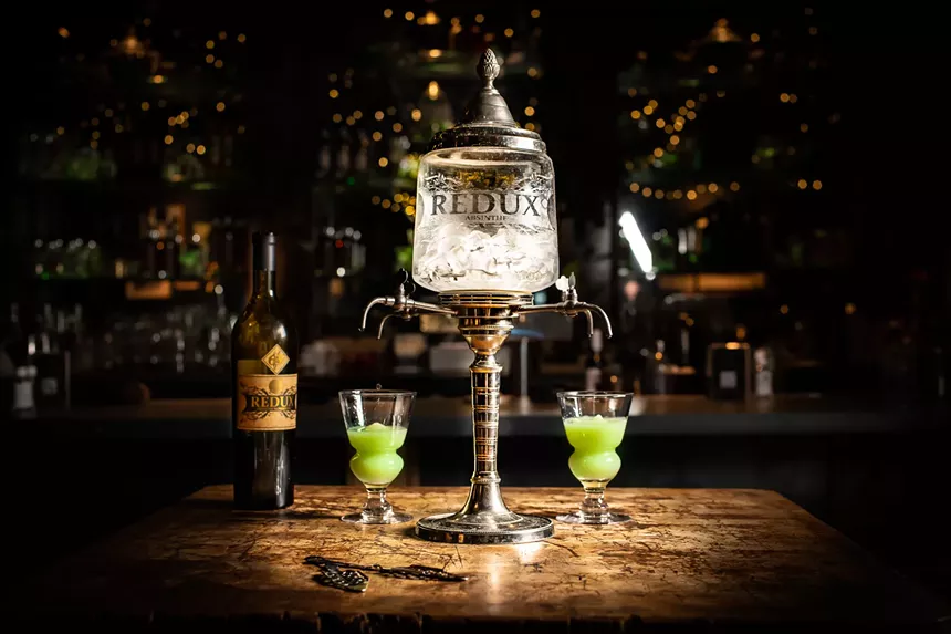 an absinthe fountain on a bar
