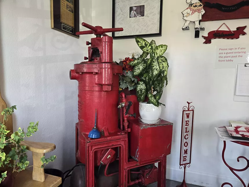 an old red pie e of equipment