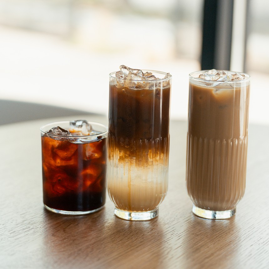 three coffee drinks on a table