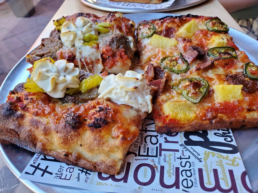 slices of square pizza on a tray