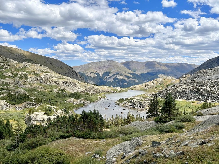 An alpine lake surrounded by rocky mountains within McCullough Gulch