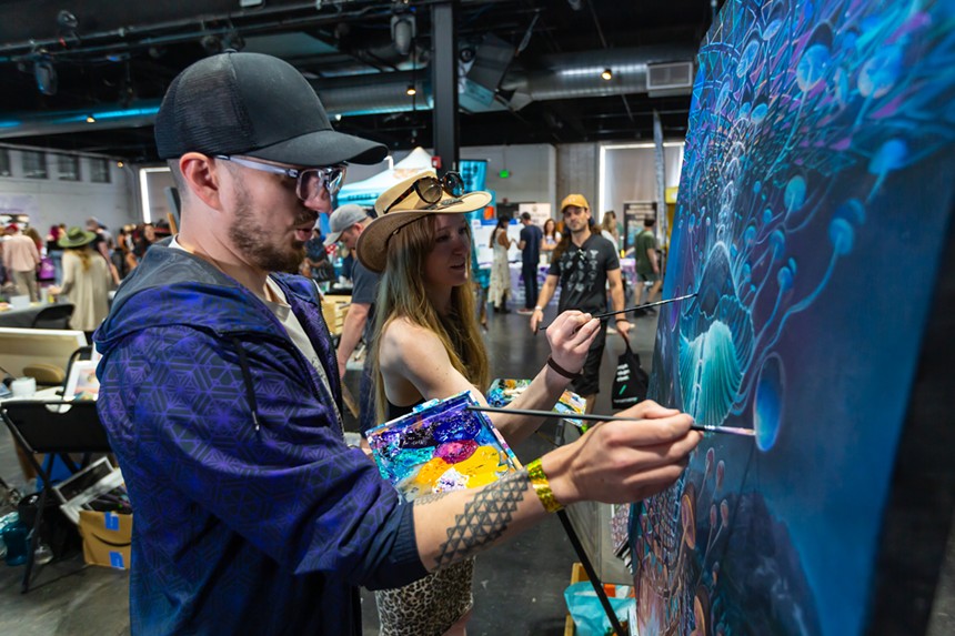 Artists paint during Denver shroom fest